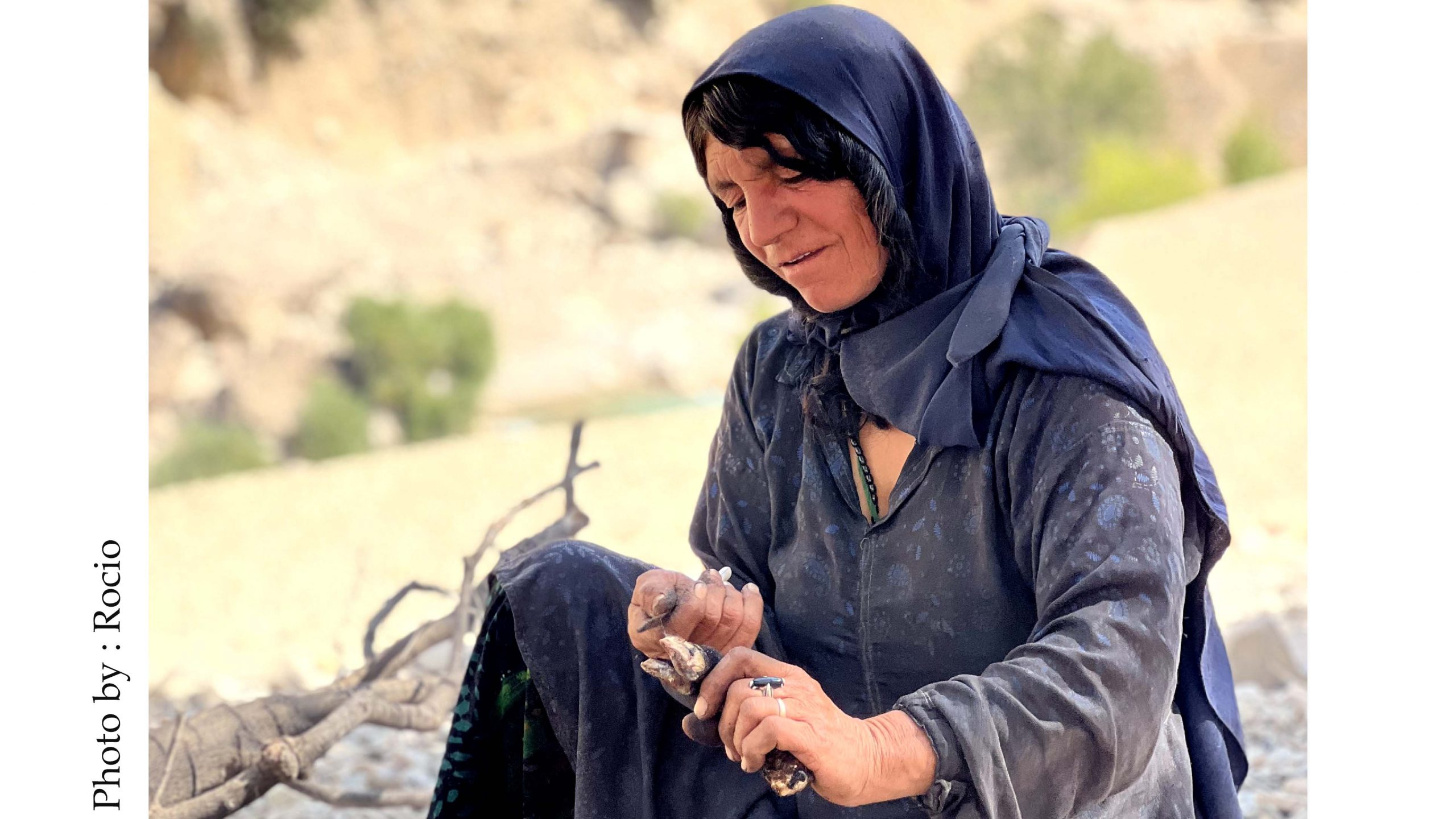 A nomad woman with Torneh, making something with knife & wood