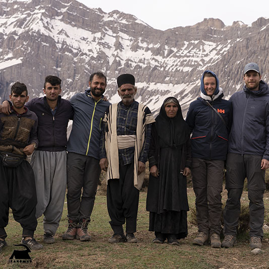 Mountain Zagros in the background, and a group of Iran's Nomad, tourists & IRANomad's Founder; Mohammad Malek shahi